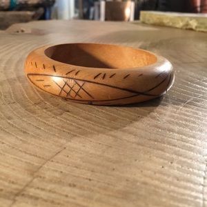 Wood bangle with fish engraving